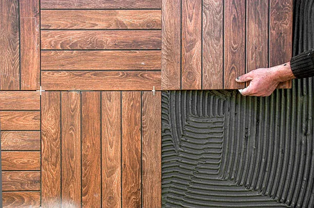 Applying new tiles on floor