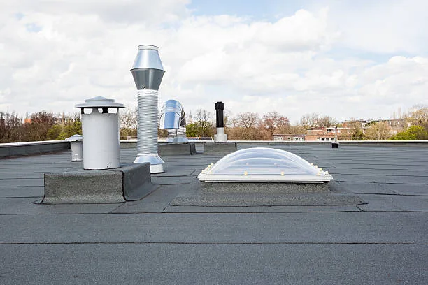 inox Chimney on the flat roof in the city