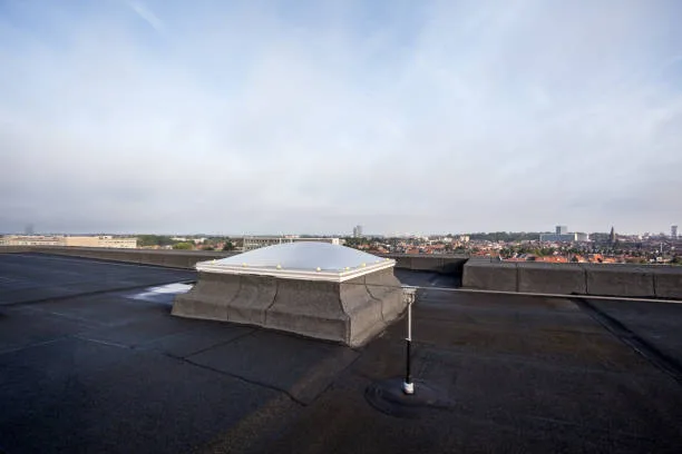Plastic dome on a flat roof on a large building in the heart of the city