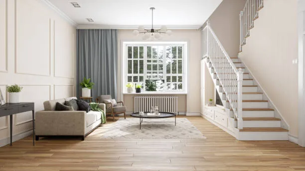 A spacious living room featuring modern decor with a comfortable sofa, stylish chairs, and a coffee table, illuminated by natural light from a large window.