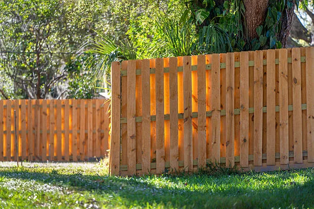 Wooden fence surrounding private property grounds for backyard protection and privacy in southern Florida.