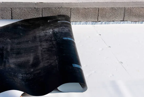 Worker on application Synthetic waterproofing PVC-P and TPO / FPO