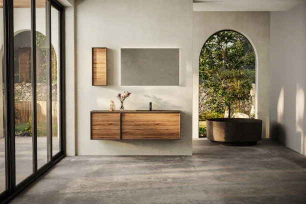Modern bathroom with marble basin, vanity and round mirror, a round bathtub, and a sleek concrete floor. The natural light, back yard.