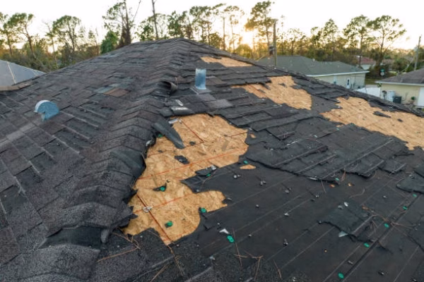 Natural disaster and its consequences. Hurricane Ian destroyed house roof in Florida residential area.