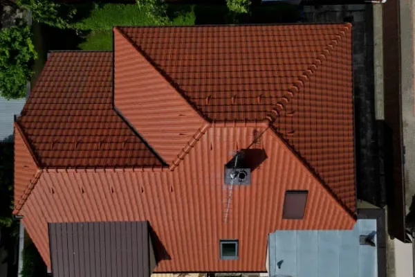 checking the cleanliness of the chimney using a drone. Cleanliness is essential for safety and the risk of soot ignition. a drone equipped with a camera inspects high on the roof. chimney work, red, alternative energy, operator, rod lightning